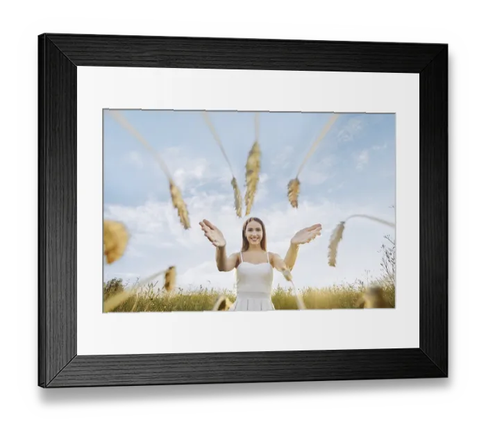 Framed Print : Happy young woman stretches her hands to the ears of wheat