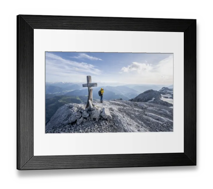 Framed Print : Mountaineer at a secondary peak of the Hochkoenig with summit cross