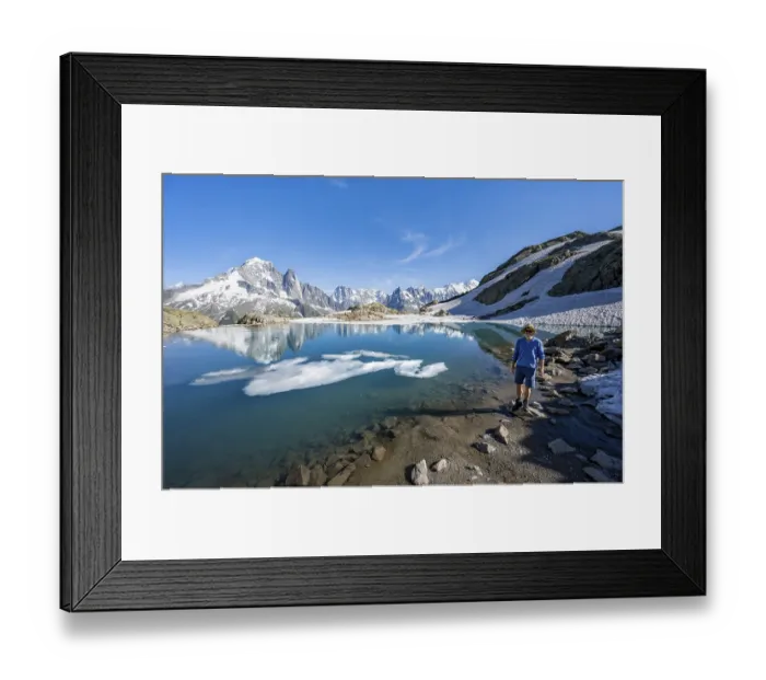 Framed Print : Mountaineer in front of mountain landscape with mountain lake