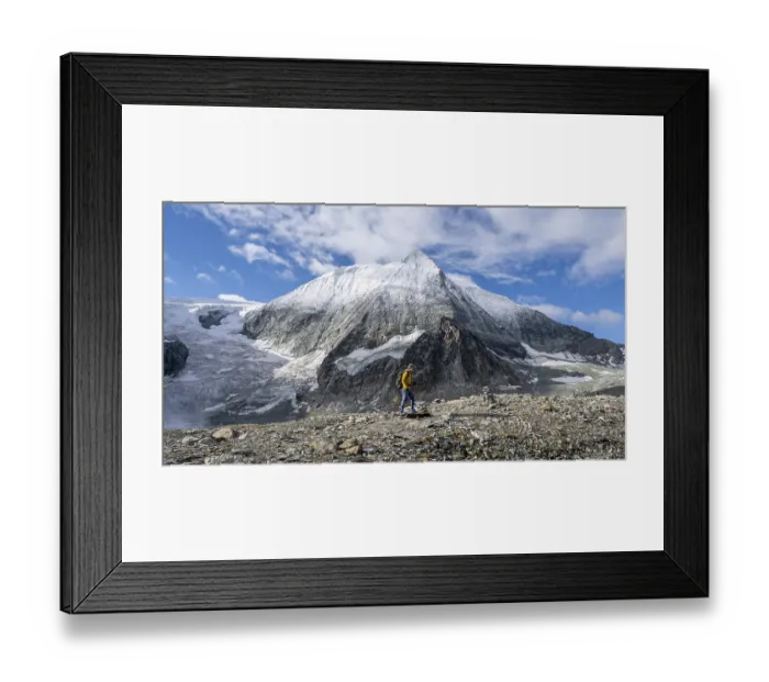 Framed Print : Mountaineer in front of the summit of Mont Blanc de Cheilon and glacier Glacier de Cheilon