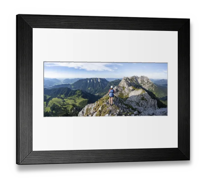 Framed Print : Hiker on a ridge in the mountains