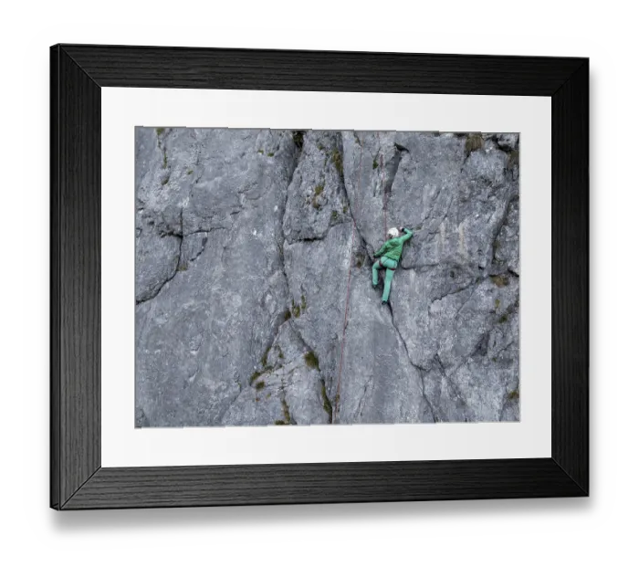 Framed Print : Sport climbing with rope, climber on a rock face Framed Print : Sport climbing with rope, climber on a rock face