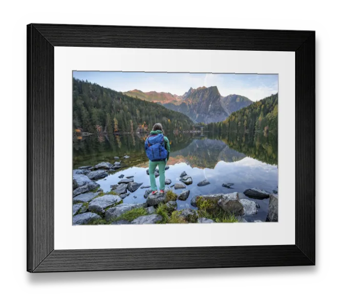 Framed Print : Hiker at the lake, mountain peaks of the Oetztal Alps are reflected in Lake Piburger See