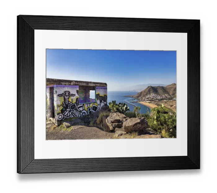 Framed Print : Ruin with graffiti, view of the sandy beach Playa de Las Teresitas