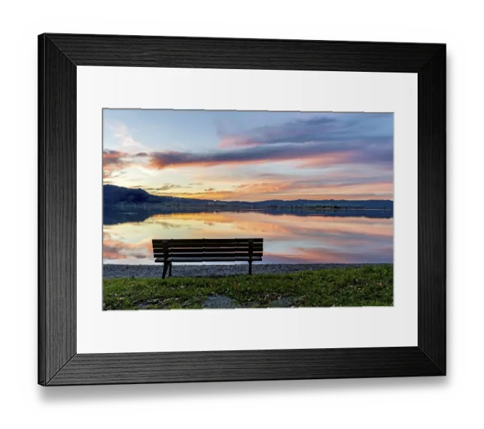 Framed Print : Bench at Lake Kochel, reflection of sun and clouds at sunset