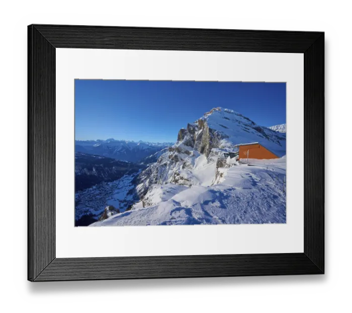 Framed Print : Snow-covered mountain landscape under a clear blue sky