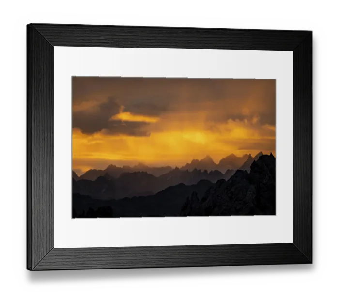 Framed Print : Montafon mountains with dramatic cloudy sky at sunrise