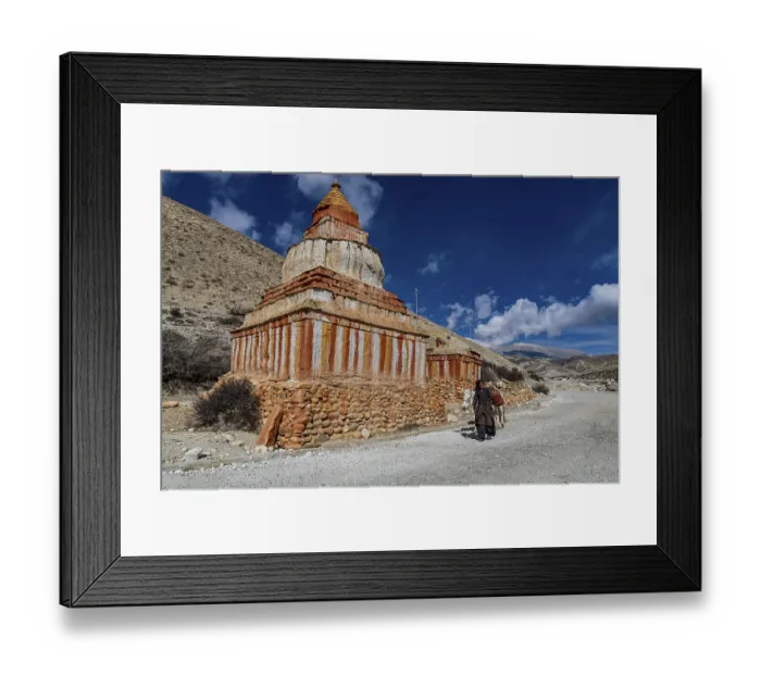 Framed Print : Woman with her horse, colourfully painted Buddhist stupa in front of mountain landscape