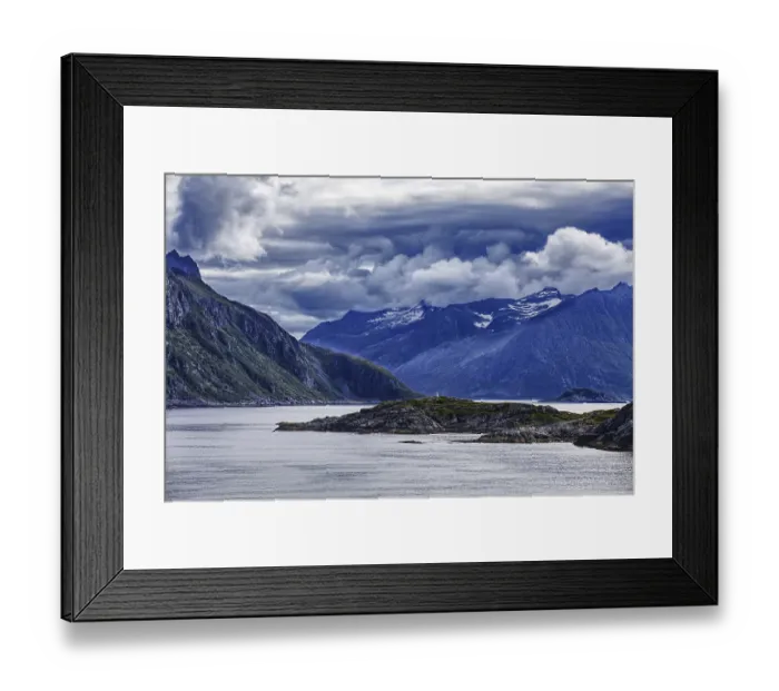 Framed Print : Dramatic fjord landscape with mountains and clouds under a stormy sky