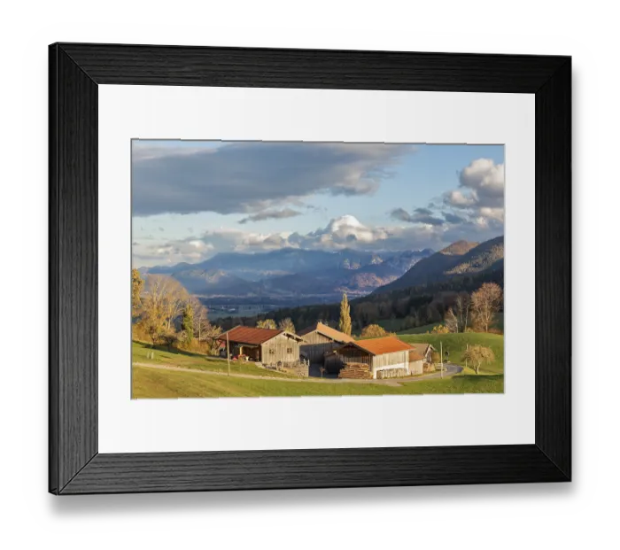 Framed Print : A picturesque farm in front of a mountain backdrop in autumn light