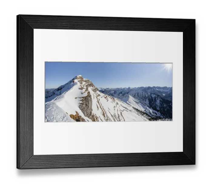 Framed Print : Ski tourers on a snow-covered mountain ridge
