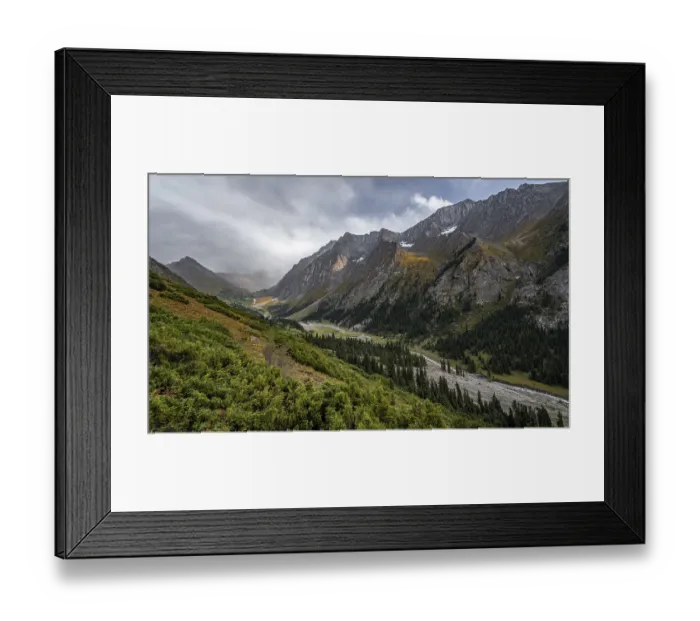 Framed Print : Green mountain valley with river and steep mountain peaks