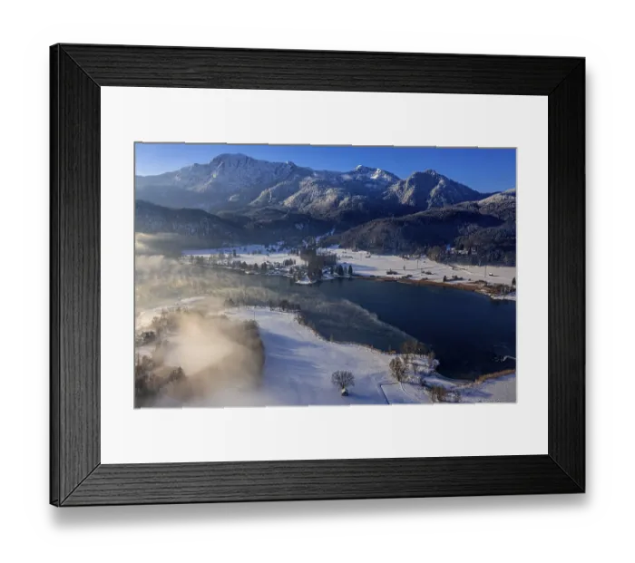 Framed Print : Aerial view of a lake in front of mountains in winter Framed Print : Aerial view of a lake in front of mountains in winter