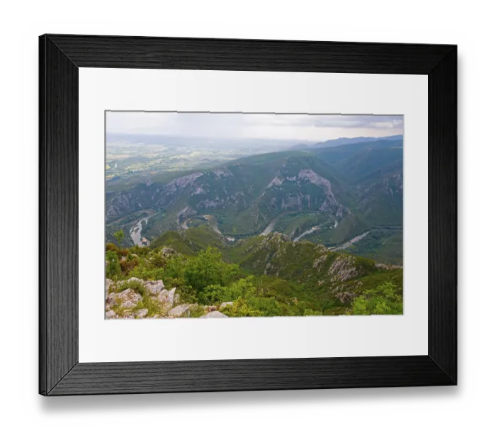 Framed Print : Breathtaking view of a river bend surrounded by a green mountain landscape Framed Print : Breathtaking view of a river bend surrounded by a green mountain landscape