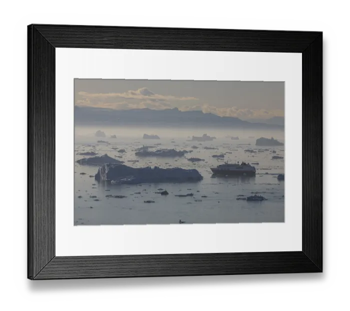 Framed Print : Hurtigruten ship sails through icebergs and ice floes