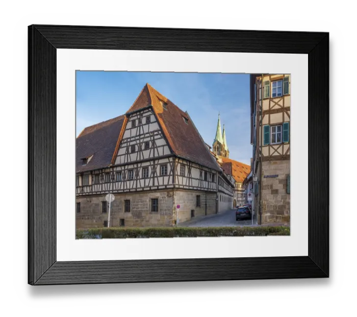 Framed Print : Alley with half-timbered houses and cobblestones