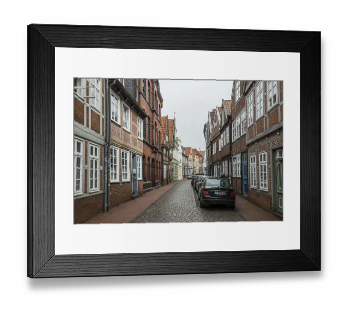 Framed Print : Half-timbered houses and alley in the old town