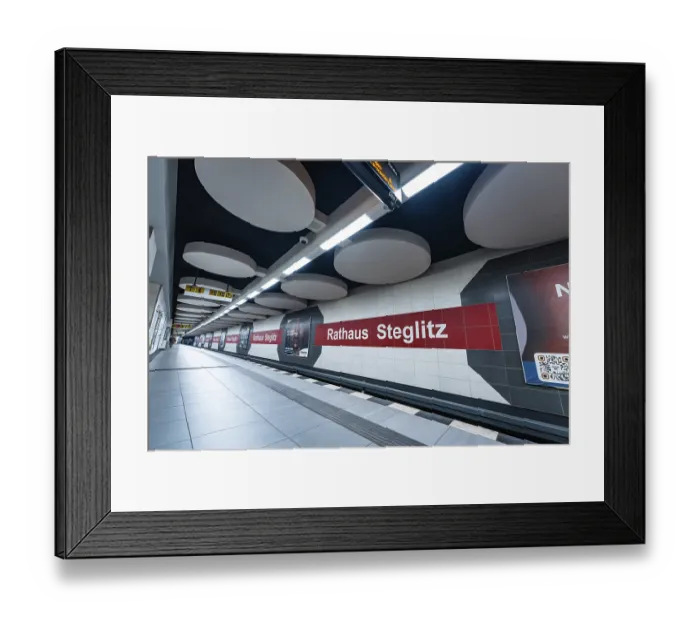 Framed Print : Modern underground station with advertising on pillars and platform in clear lines