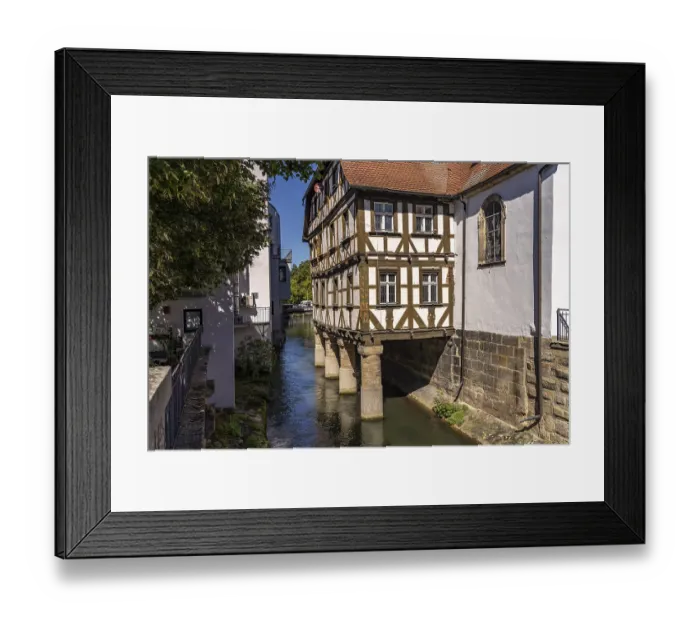 Framed Print : Half-timbered hospital building on piles in the water
