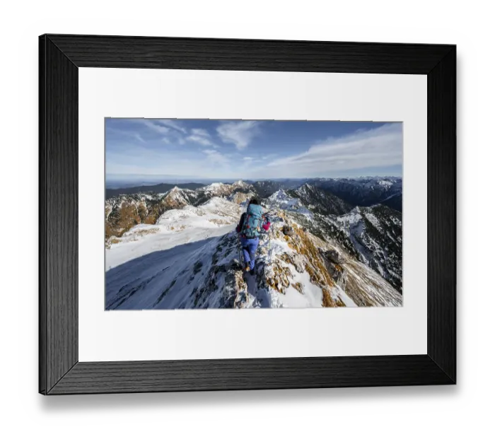 Framed Print : Mountaineer on the narrow rocky snowy ridge of the Ammergauer Hochplatte