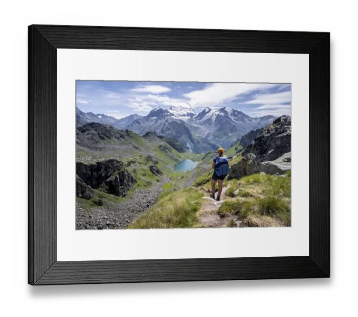 Framed Print : Hiker on hiking trail, mountain lake Lac de Louvie with glaciated summit of the Grand Combin Framed Print : Hiker on hiking trail, mountain lake Lac de Louvie with glaciated summit of the Grand Combin
