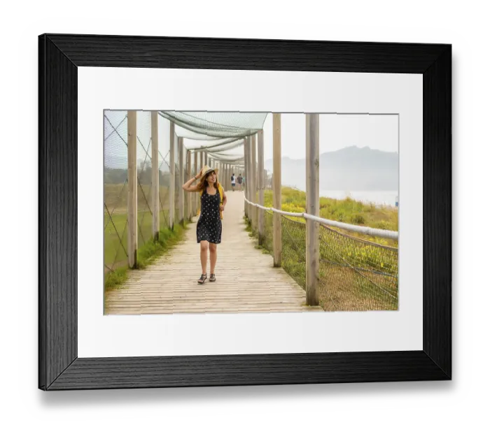 Framed Print : Summer vacation lifestyle. Young and adventurous Caucasian girl enjoying the summer walking alone along the beach