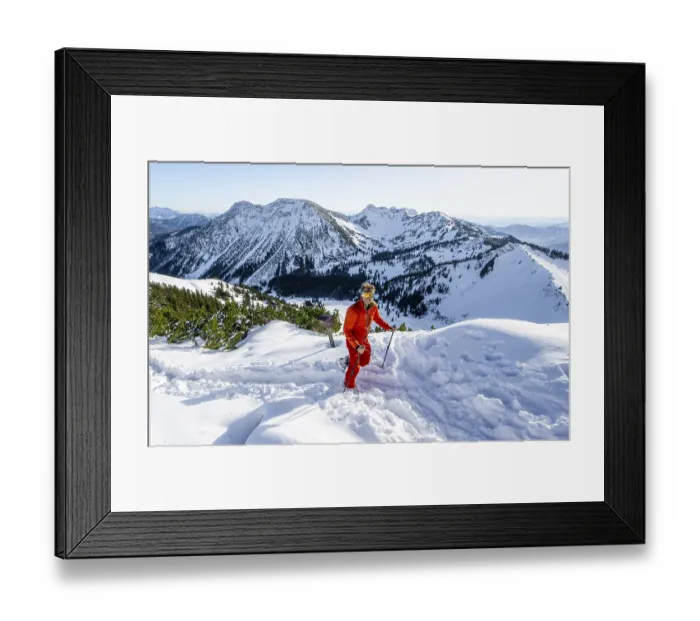 Framed Print : Mountaineer at the summit of the Aiplspitz in the snow