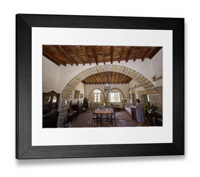 Framed Print : Dining room with round arch, rustic wooden floors