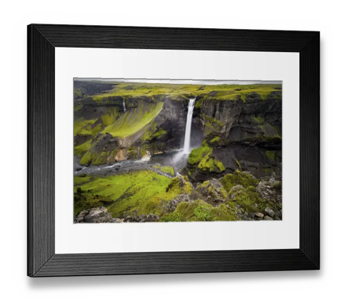 Framed Print : River and waterfalls at a canyon with green moss