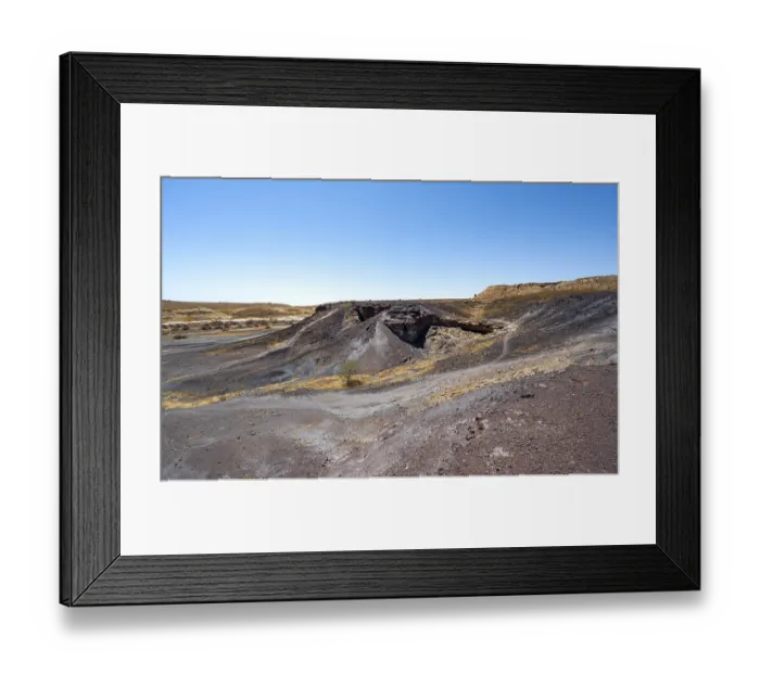Framed Print : Dry landscape with yellow grass and black volcanic hills