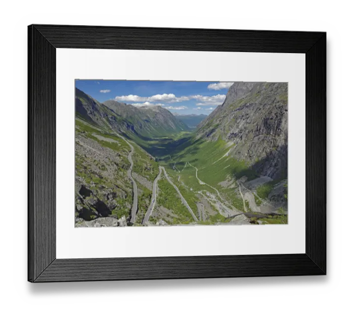Framed Print : Mountain road winds up the mountain in serpentines