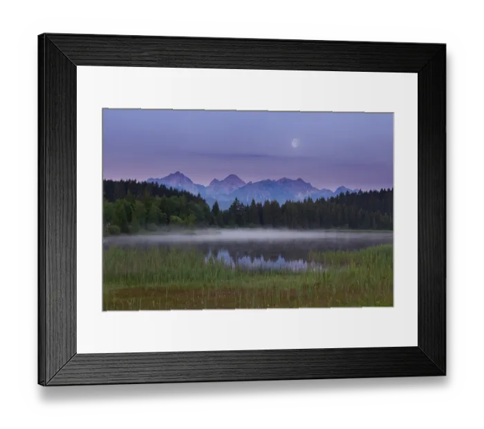 Framed Print : Idyllic lake at dusk with mountains and forests in the background Framed Print : Idyllic lake at dusk with mountains and forests in the background