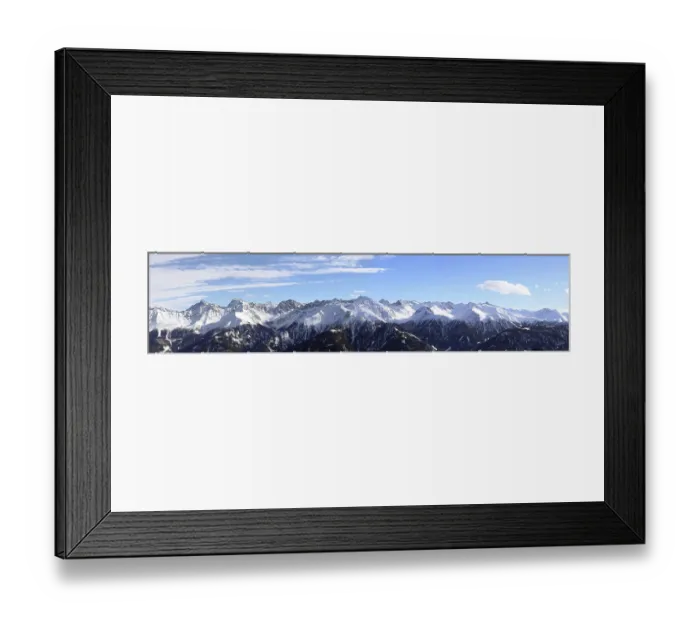 Framed Print : Alpine panorama with snow-covered mountain peaks in winter