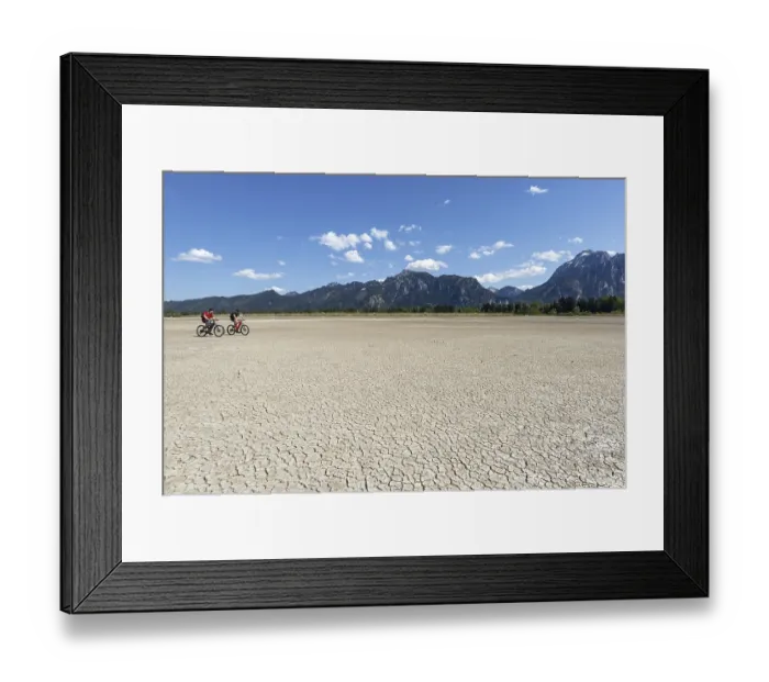 Framed Print : Cracked, dried out ground, waterless Forggensee in spring