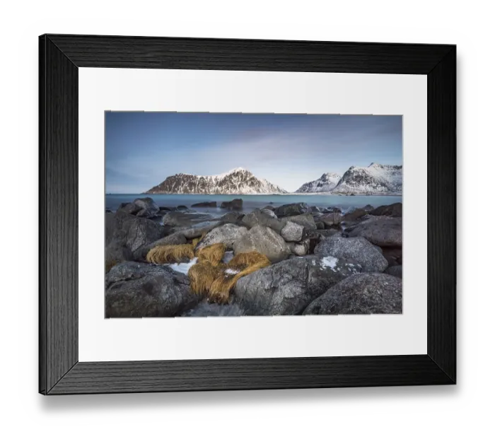 Framed Print : Rocky coast, mountains in the background
