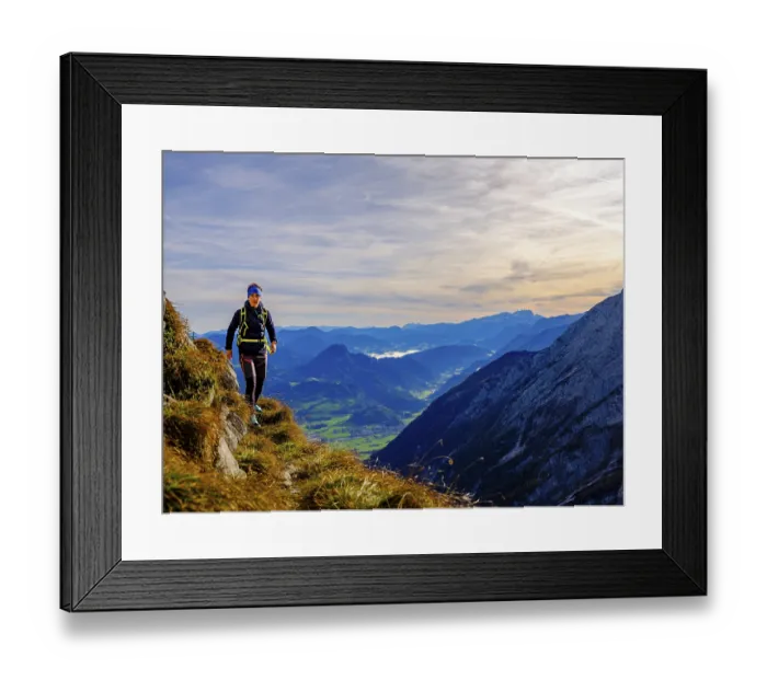 Framed Print : Mountaineer walking on a narrow path above the Salzach valley