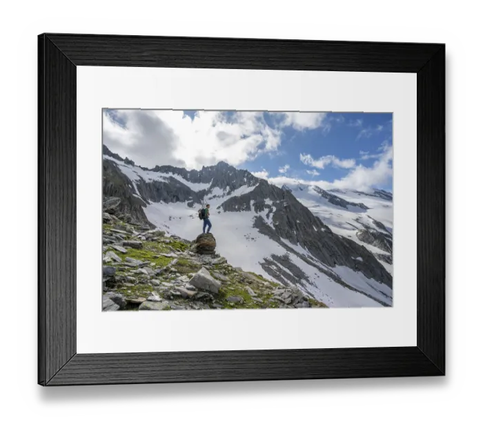 Framed Print : Mountaineer on a rock, rocky mountain peak Furtschaglspitze in the background Framed Print : Mountaineer on a rock, rocky mountain peak Furtschaglspitze in the background