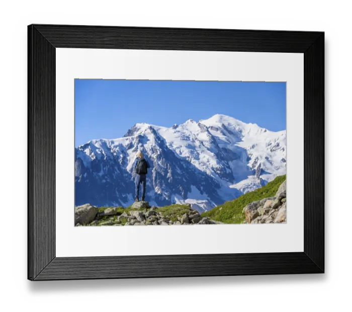 Framed Print : Mountaineer in front of mountain landscape