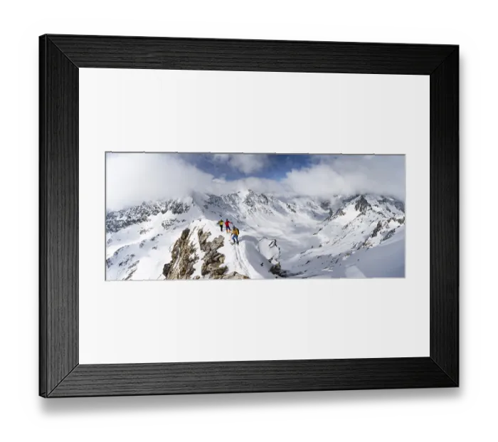 Framed Print : Three mountaineers climbing the narrow ridge of Piz Laviner