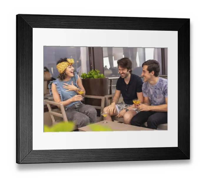 Framed Print : Friends having fun and laughing drinking cocktails in a terrace