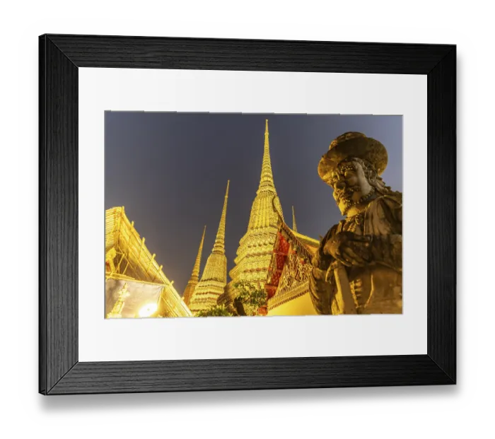 Framed Print : Giant Farang Guard and Chedi of the Buddhist temple Wat Pho at dusk Framed Print : Giant Farang Guard and Chedi of the Buddhist temple Wat Pho at dusk