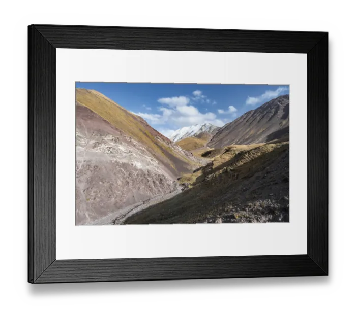 Framed Print : Valley with mountain stream between high mountains in autumn