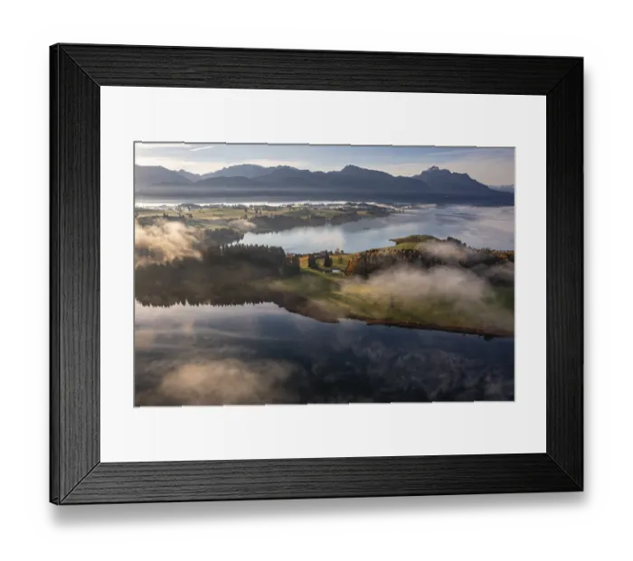 Framed Print : Aerial view of a lake in front of mountains in the morning light