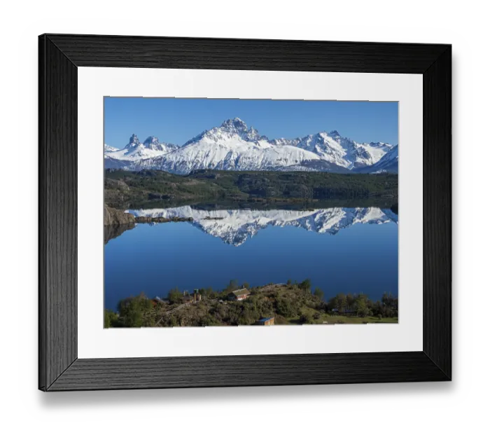Framed Print : The snow-covered Mt. Cerro Castillo is reflected in a lake Framed Print : The snow-covered Mt. Cerro Castillo is reflected in a lake