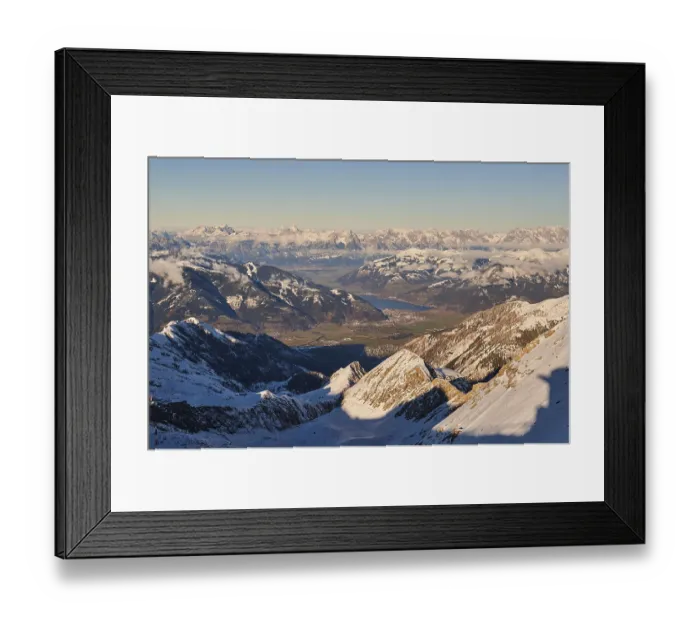 Framed Print : View from Mount Kitzsteinhorn on snow covered mountains down to Zell am See