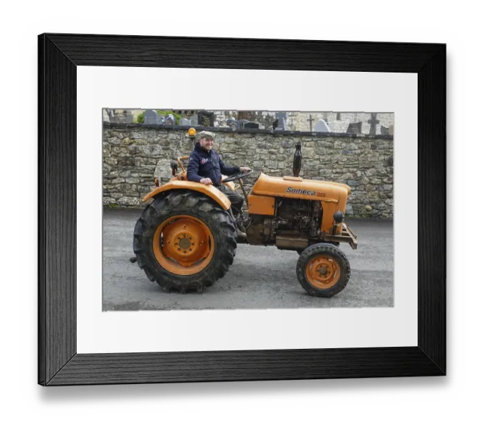 Framed Print : Old tractor Someca in front of church and chapel Sainte Nonne