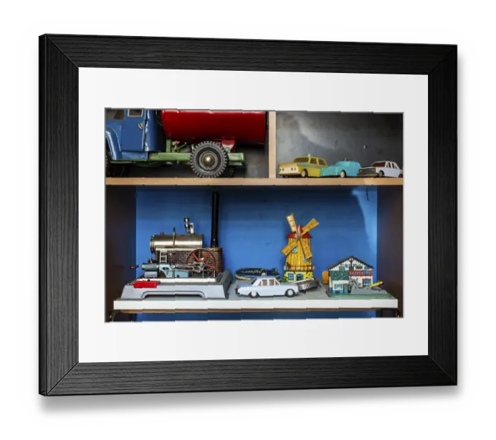 Framed Print : Old vintage toys on shelf. Collection of vintage cars toys in a shop Framed Print : Old vintage toys on shelf. Collection of vintage cars toys in a shop