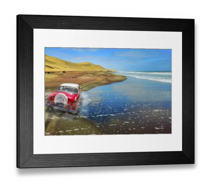 Framed Print : A vintage pink car on a sandy road with dunes and ocean background Framed Print : A vintage pink car on a sandy road with dunes and ocean background