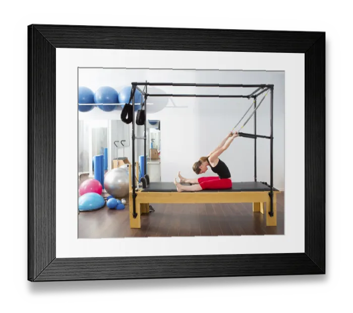 Framed Print : Aerobics pilates instructor woman in cadillac fitness exercise