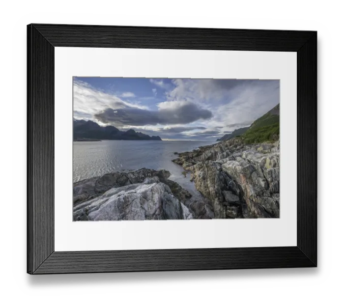 Framed Print : Rock structures on the coast near Husoy